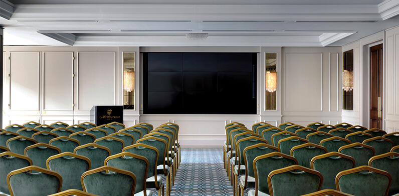 Conference room set up Theatre Style with large flat screen TV