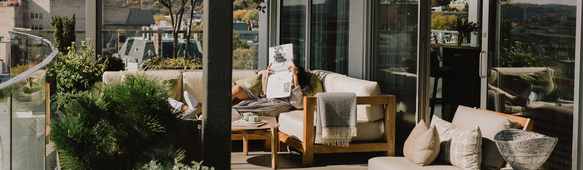 Guest relaxing on the private terrace of a luxury suite at The Dupont Hotel in Washington, D.C.
