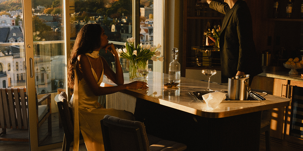 Luxury in-suite dining at The Penthouse, Washington D.C., showing the open-plan dining and living space tailored for exclusive guest experiences.