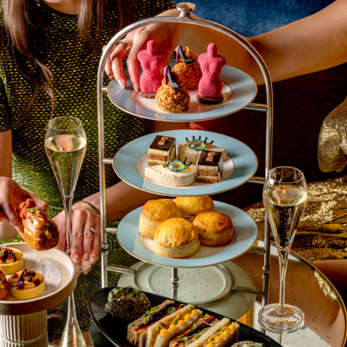 Schiaparelli-themed afternoon tea cakes and surrealist-inspired desserts, part of the Fashion Becomes Tea experience at The Kensington