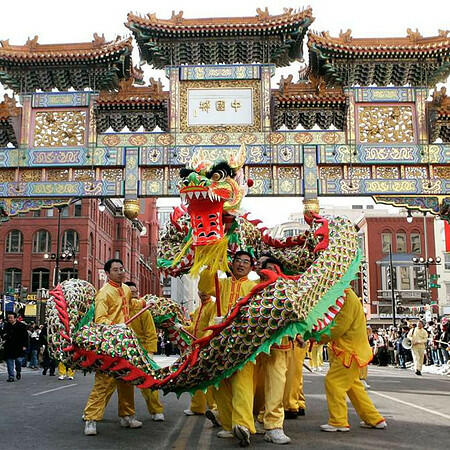 A vibrant Chinese New Year parade in DC’s Chinatown featuring traditional lion dancers