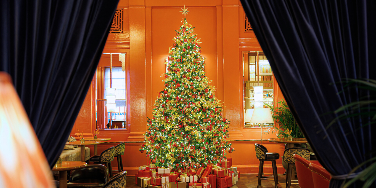 A Christmas tree decorated with Waterford crystal baubles, located in the Coral Room at The Bloomsbury Hotel.