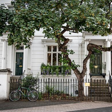 London home with a bicyce at the front