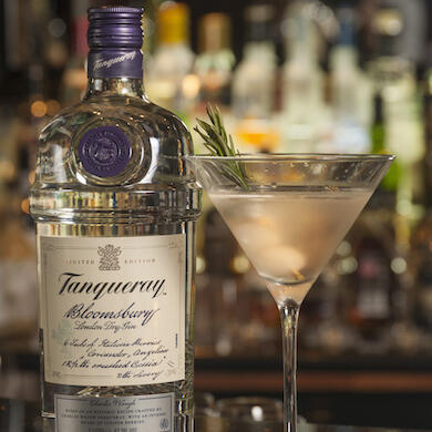 The Bloomsbury Gibson cocktail with a bottle of Tanqueray gin
