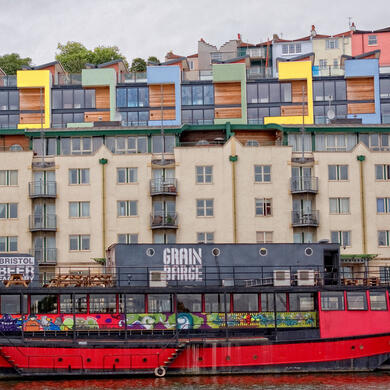 Grain Barge with colourful Bristol apartments in the background