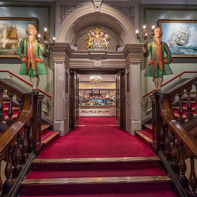 Red carpeted staircase in Fortnum and Mason