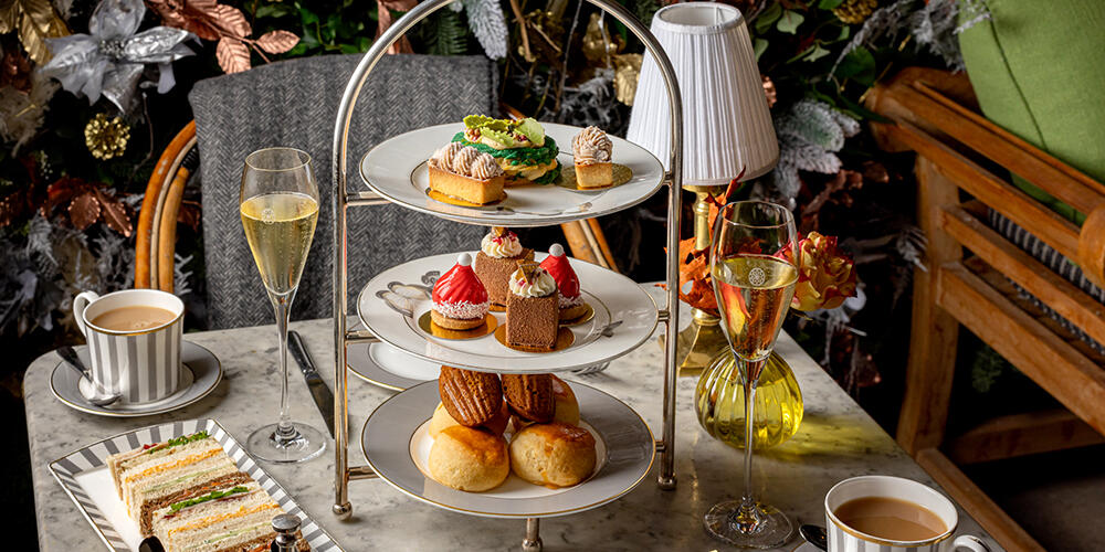 Festive Afternoon Tea served with two glasses of champagne on The Dalloway Terrace at The Bloomsbury Hotel, Central London.