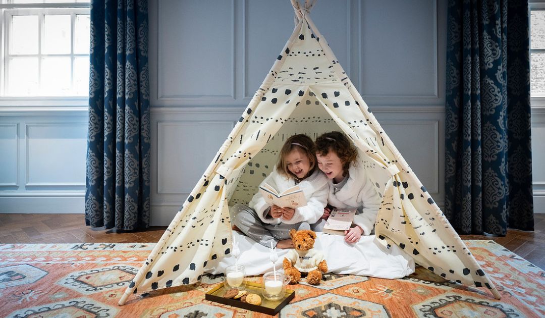 Spacious Family Suites at The BloomsburyShowing 2 kids playing in a tent at the bloomsbury hotel