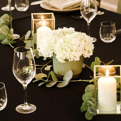 Table with white hydrangeas and candels