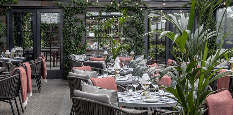 outdoor terrace at Hawthorn with tables set for dining