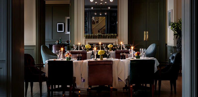 Private dining room at Townhouse lit by candle light