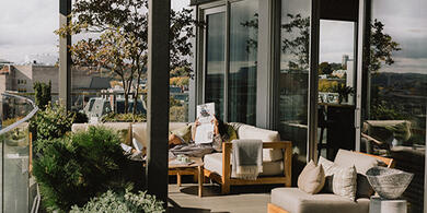 Guest relaxing on the private terrace of a luxury suite at The Dupont Hotel in Washington, D.C.