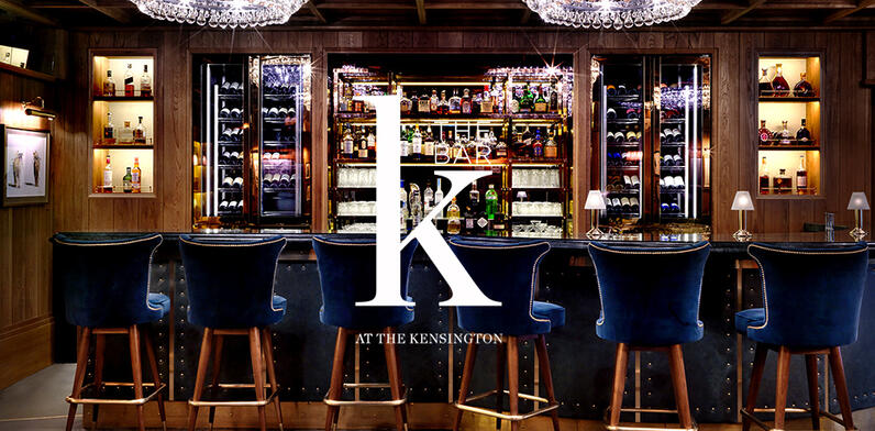 The K Bar with blue velvet bar stools