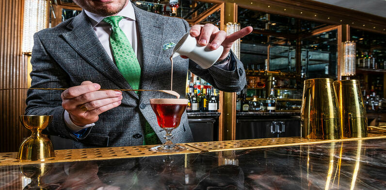 Expert mixologists at The Dupont Circle handcrafting a signature cocktail in celebration of Irish Heritage Month.