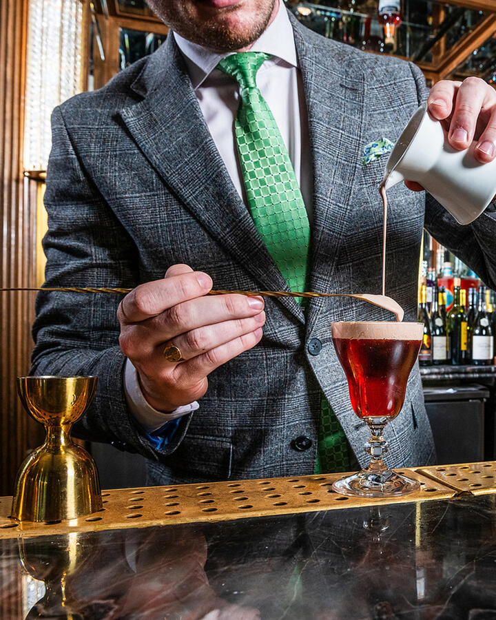 Expert mixologists at The Dupont Circle handcrafting a signature cocktail in celebration of Irish Heritage Month.
