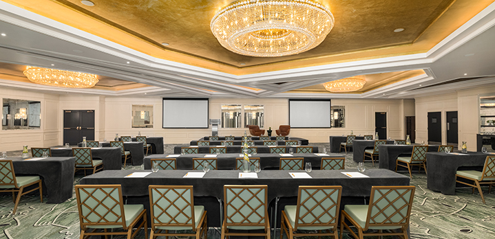 Classroom seating arrangement in The Dupont Ballroom, featuring orderly rows of tables and chairs set for a professional meeting or workshop at The Dupont Circle hotel.