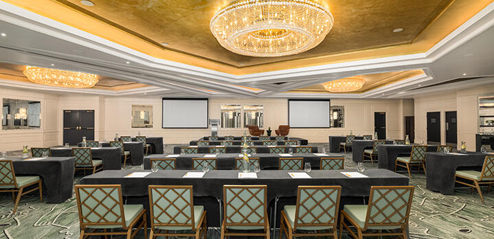 Classroom seating arrangement in The Dupont Ballroom, featuring orderly rows of tables and chairs set for a professional meeting or workshop.
