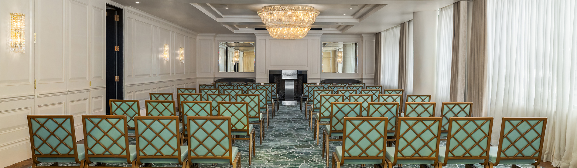 Meeting tables in the Foxhall room set in a hollow square, with chairs positioned around the perimeter facing inward.