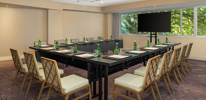Wide-angle view of the Georgetown Room set in a U-shape for a meeting in The Dupont Circle hotel in Washington DC.