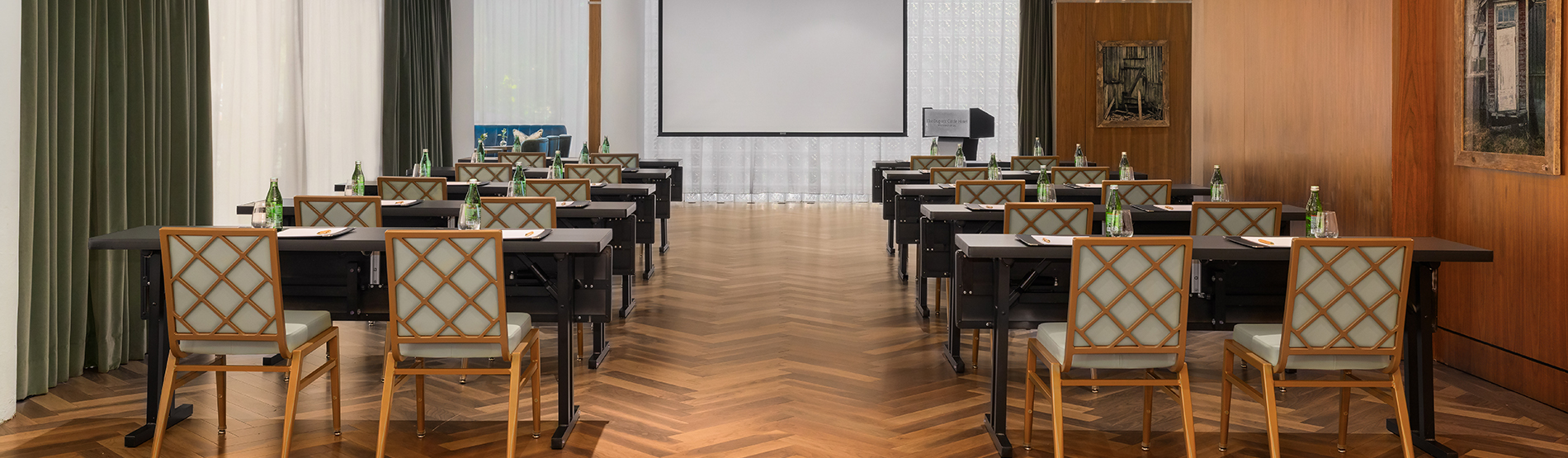 A wide-angle view of the Glover Park meeting space configured with structured classroom seating. 