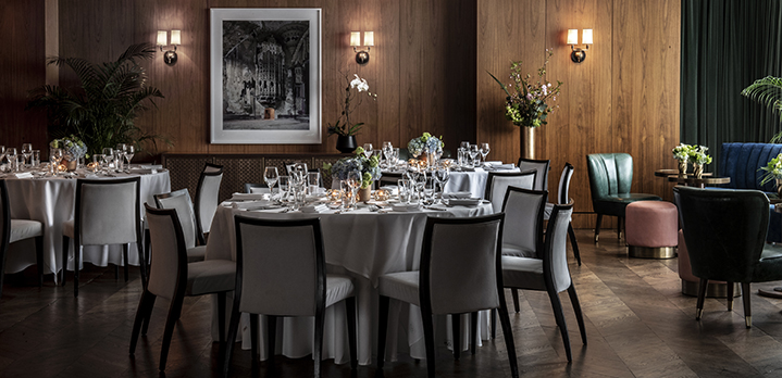 Formal table arrangements for a private social gathering in the Glover Park event space, featuring elegant linens and professional decor.