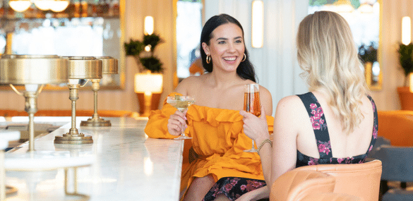 Sitting at the bar drinking cocktails