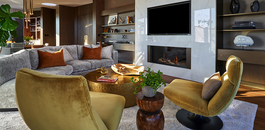Suite living room with seating area, fireplace and TV