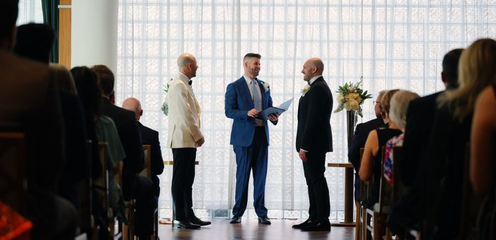 A beautiful gay wedding at Foxhall in The Dupont Circle Hotel, capturing the couple’s first moments after being pronounced married