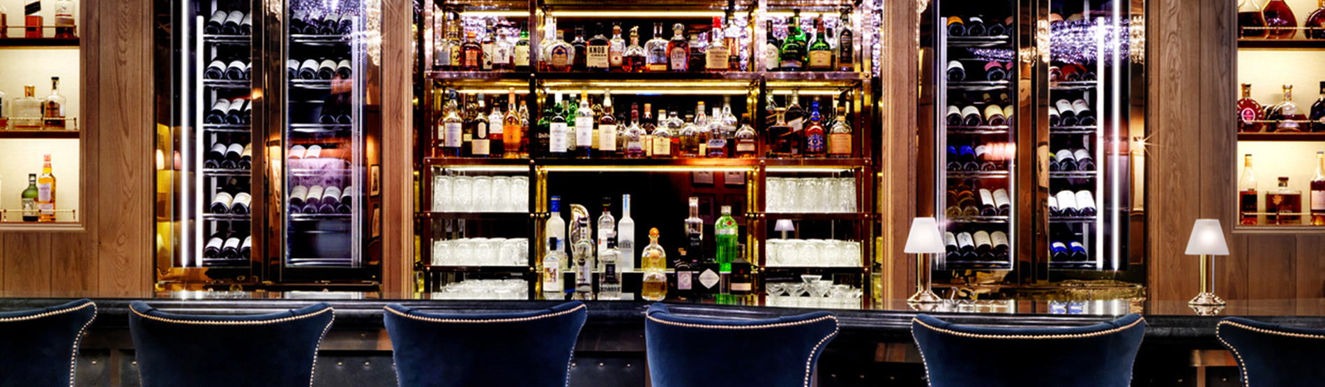 The K Bar with blue velvet bar stools