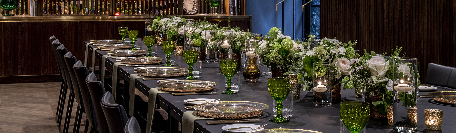 Long banquet table setup at The Marylebone with elegant floral centerpieces and private event styling