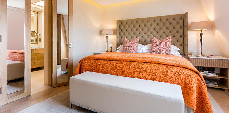 The Harley Suite, spacious suite with orange hues bringing a wlecoming warmth to the suite