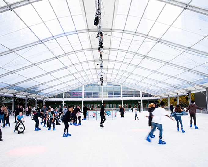 People Ice skating at the Canary Warf Ice Rink