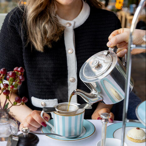 Elegant afternoon tea at The River Lee Hotel, where a lady receives her tea service.