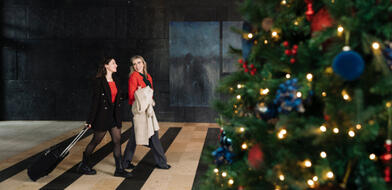 Ladies walking in the Hotel foyer decorated for Christmas