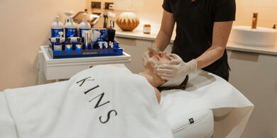 Lady enjoying a KINS facial treatment as part of The River Lee's Kin & KINS Offer, experiencing ultimate relaxation.