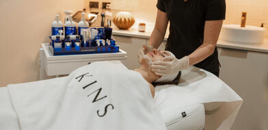 Lady enjoying a KINS facial treatment as part of The River Lee's Kin & KINS Offer, experiencing ultimate relaxation.
