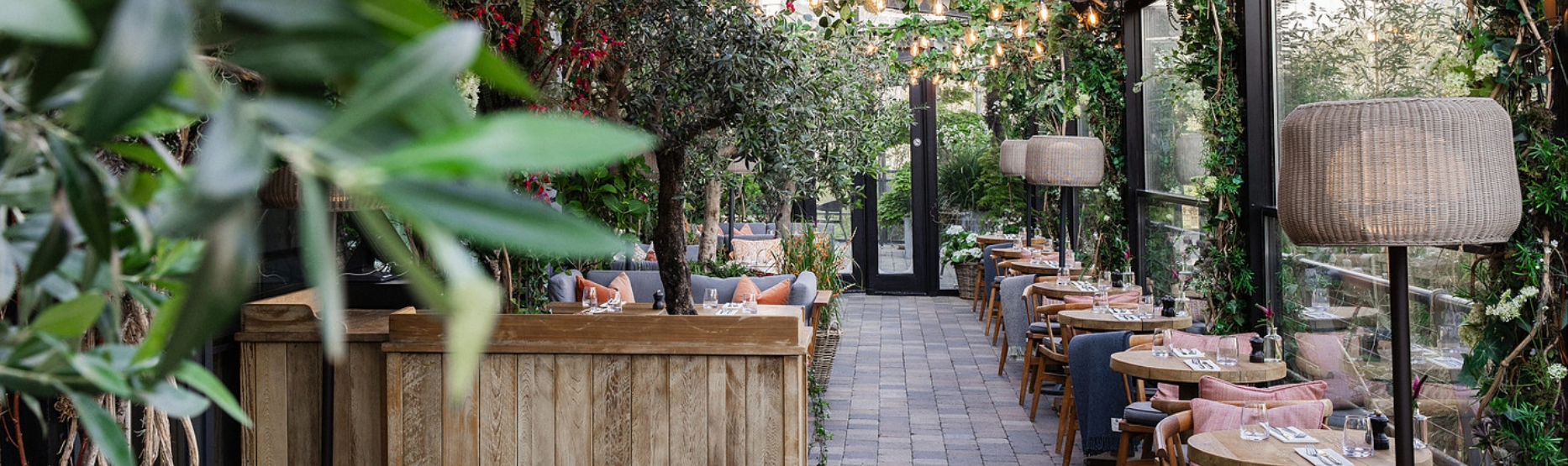 A tranquil spring scene of The River Club Terrace at The River Lee Hotel, overlooking the River Lee.