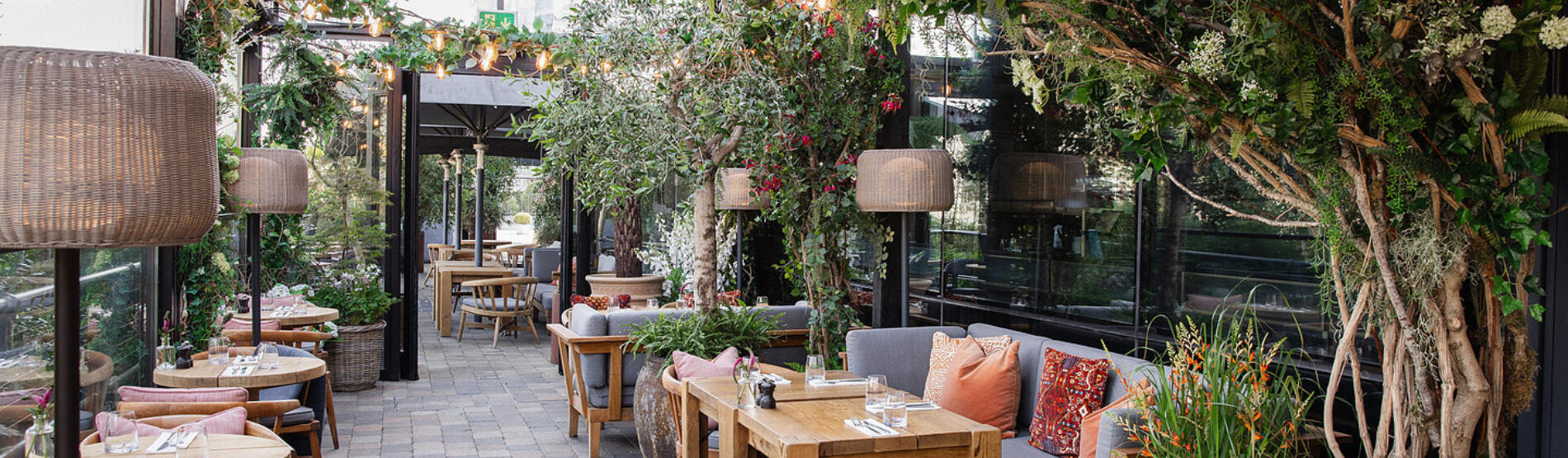 A tranquil spring scene of The River Club Terrace at The River Lee Hotel, overlooking the River Lee.