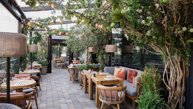 A tranquil spring scene of The River Club Terrace at The River Lee Hotel, overlooking the River Lee.