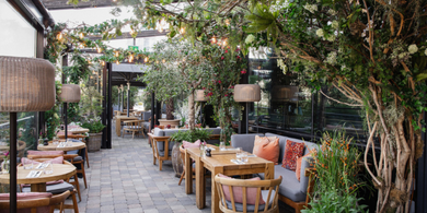 A tranquil spring scene of The River Club Terrace at The River Lee Hotel, overlooking the River Lee.