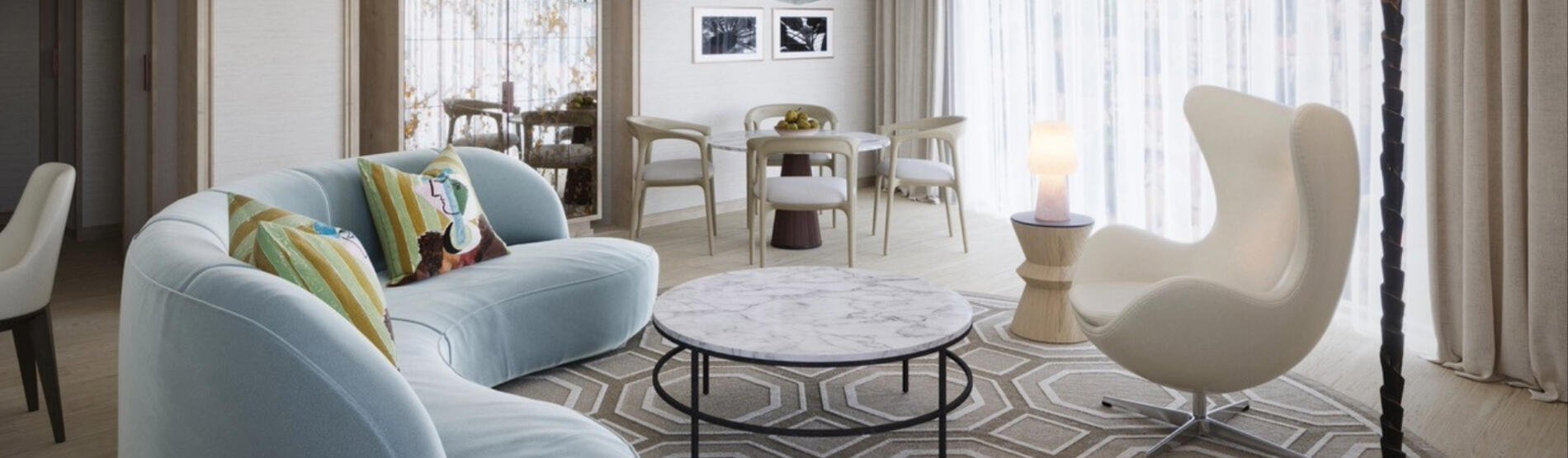 Illustrative preview of how a luxury suite at The River Lee Hotel may look, featuring a stylish sofa, table, and large windows, representing the design of the hotel’s new luxury and studio suites.