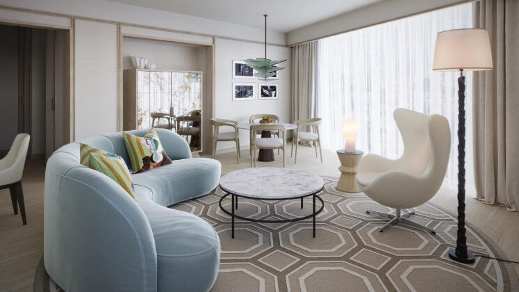 Illustrative preview of how a luxury suite at The River Lee Hotel may look, featuring a stylish sofa, table, and large windows, representing the design of the hotel’s new luxury and studio suites.