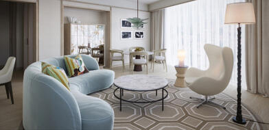 Illustrative preview of how a luxury suite at The River Lee Hotel may look, featuring a stylish sofa, table, and large windows, representing the design of the hotel’s new luxury and studio suites.