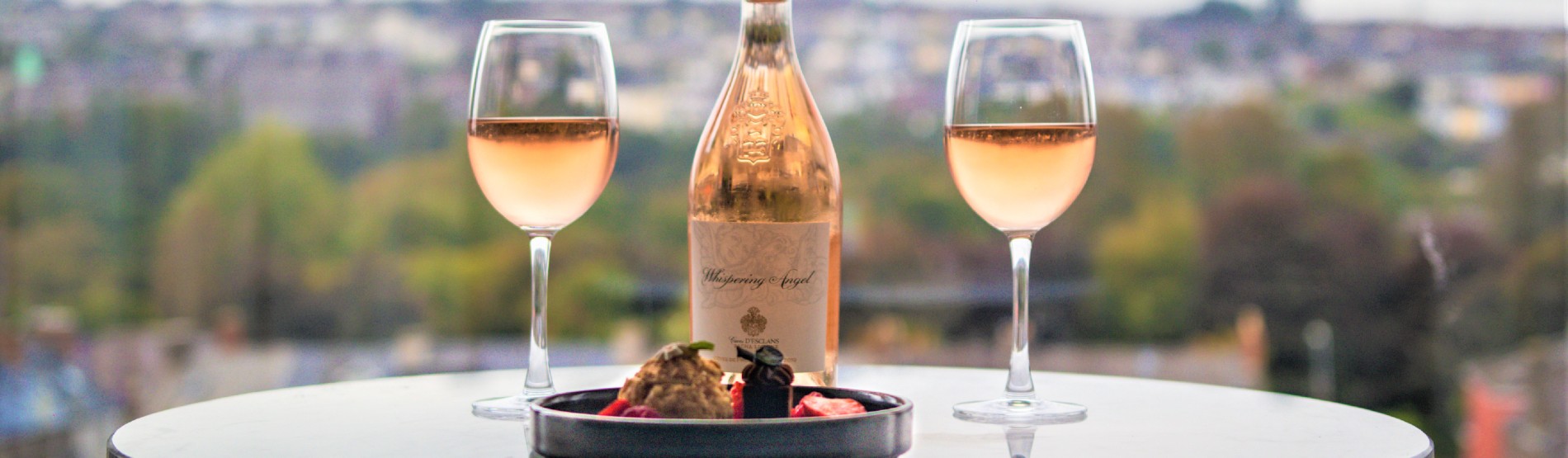 Rose wine and two glasses at The River Lee