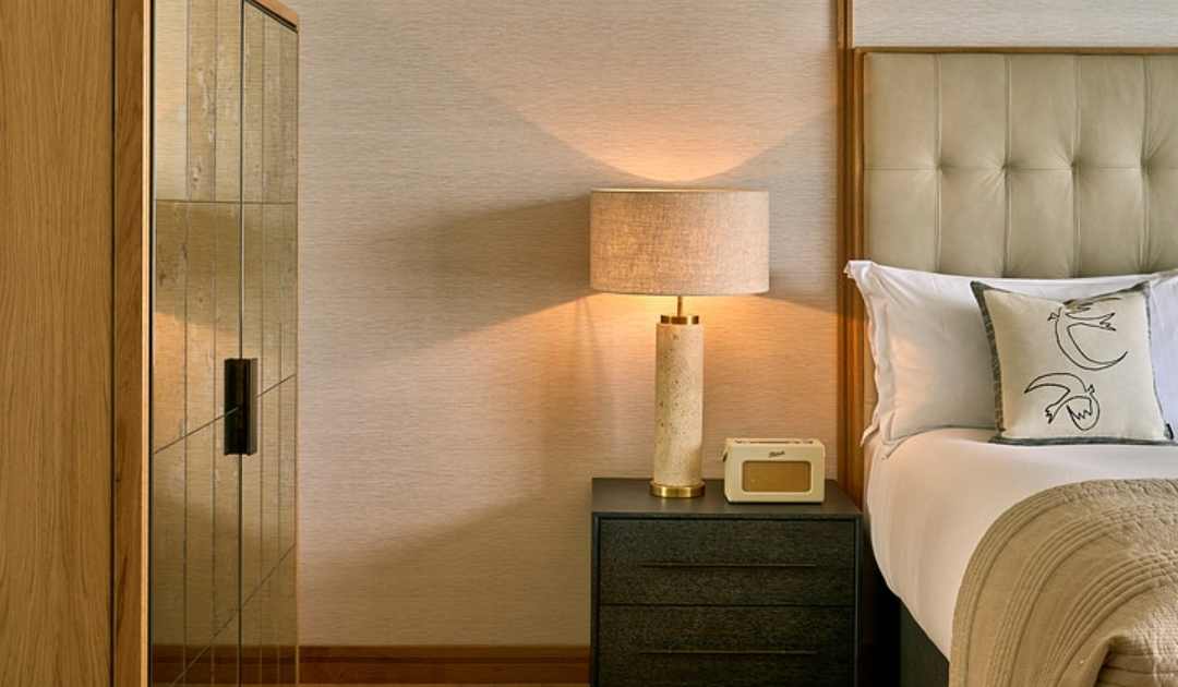 Luxury Suite Bedroom Illustration: King bed and window seating area at The River Lee Hotel