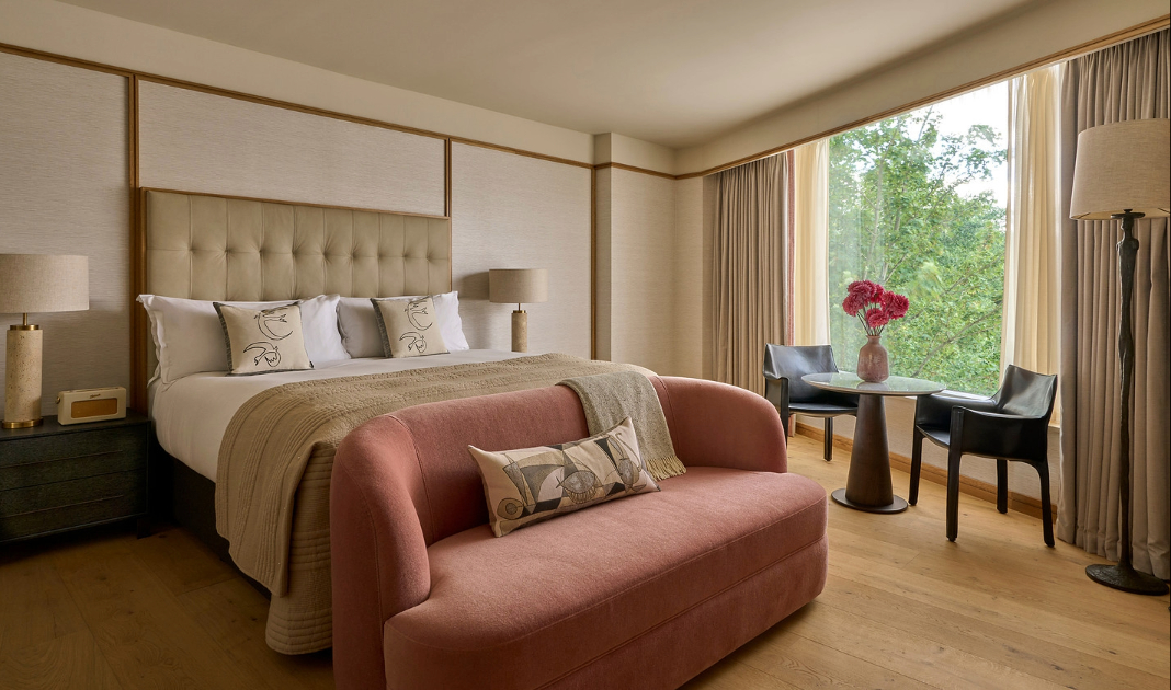 Luxury Suite Bedroom Illustration: King bed and window seating area at The River Lee Hotel