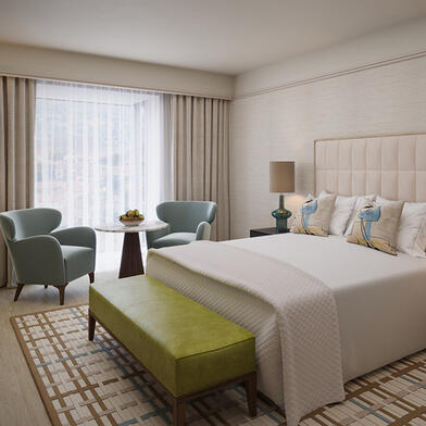 Luxury Suite Bedroom Illustration: King bed and window seating area at The River Lee Hotel