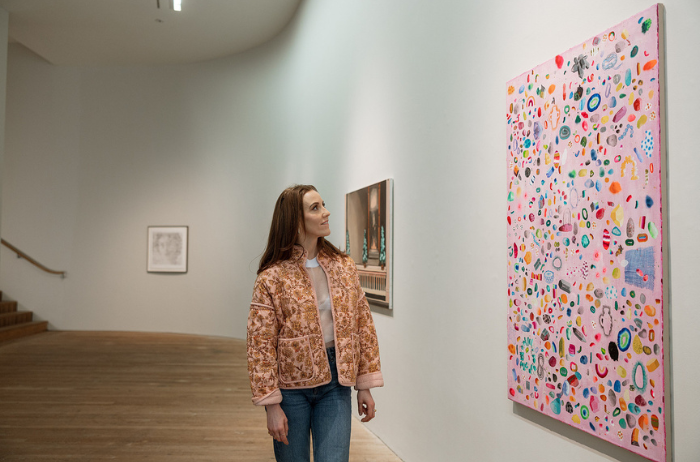 Louise stands inside the Glucksman Gallery at UCC, looking at artworks during a morning visit.