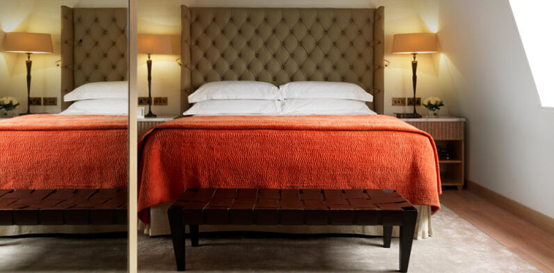 Marylebone Suite with bed and mood lighting setting the luxurious tone