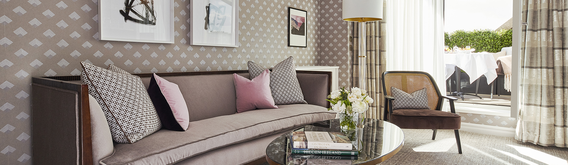 Terrace Suite at The Westbury Hotel: Luxury redefined, offering expansive views of the suite's sophisticated seating area, plus a framed view of the outside terrace.